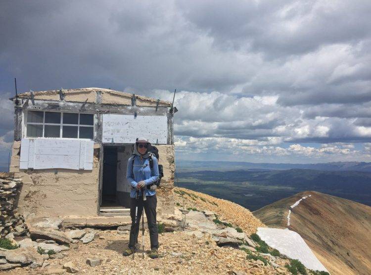 Woman on top of Mountain Range